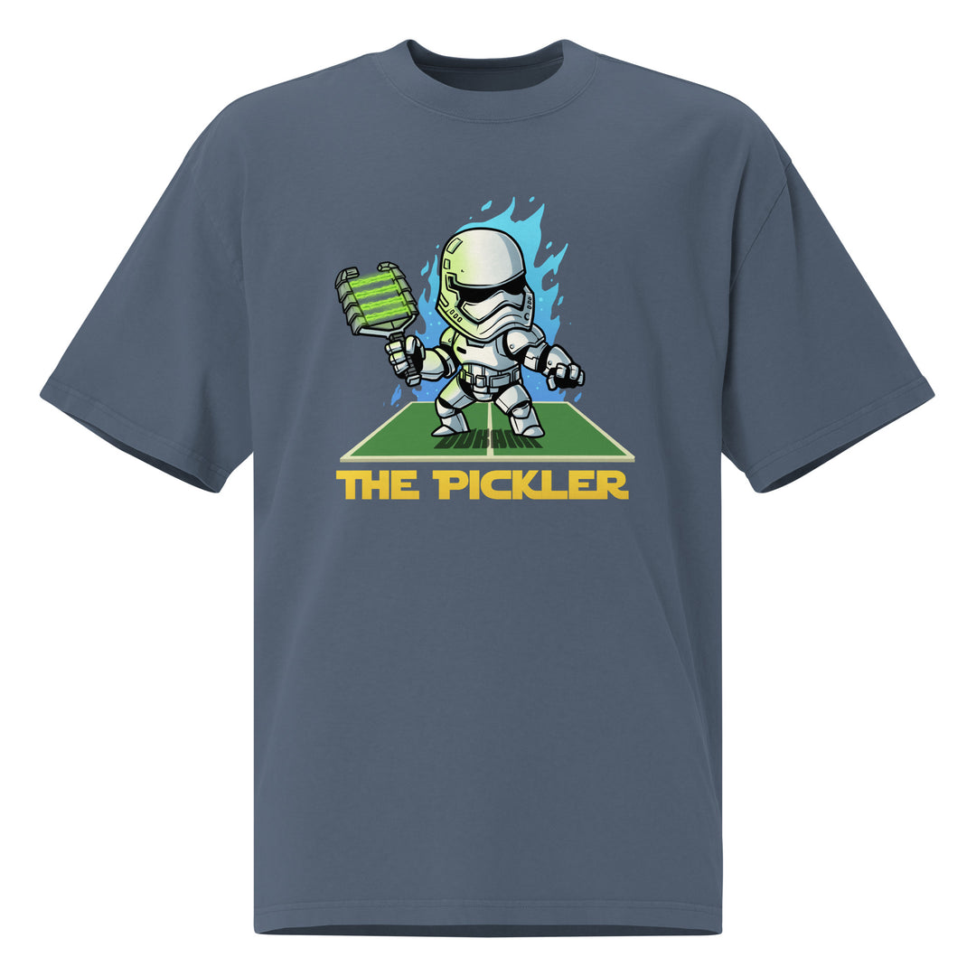 The Pickler faded pickleball T-shirt featuring a cartoon white-armored stormtrooper holding a green paddle with blue flames and court graphic