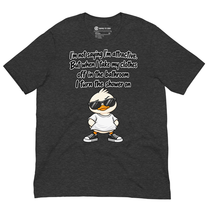 Dark grey heather T-shirt featuring a cartoon duck in sunglasses beneath the “I’m Not Saying I’m Attractive” shower joke