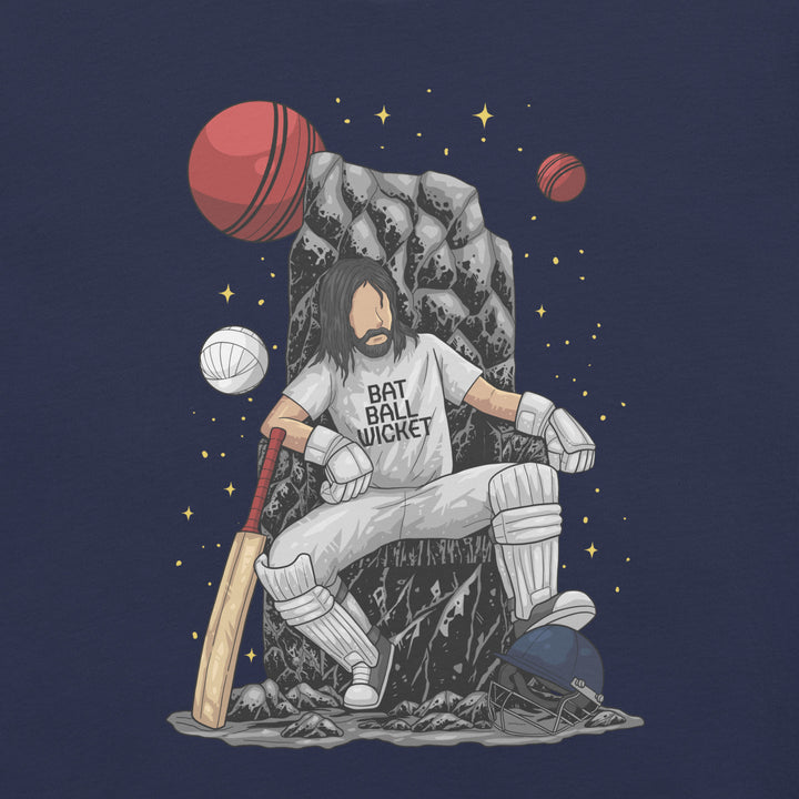 King of the Crease cricket T-shirt featuring a cricketer seated on a stone throne with orbiting cricket balls, a bat and helmet