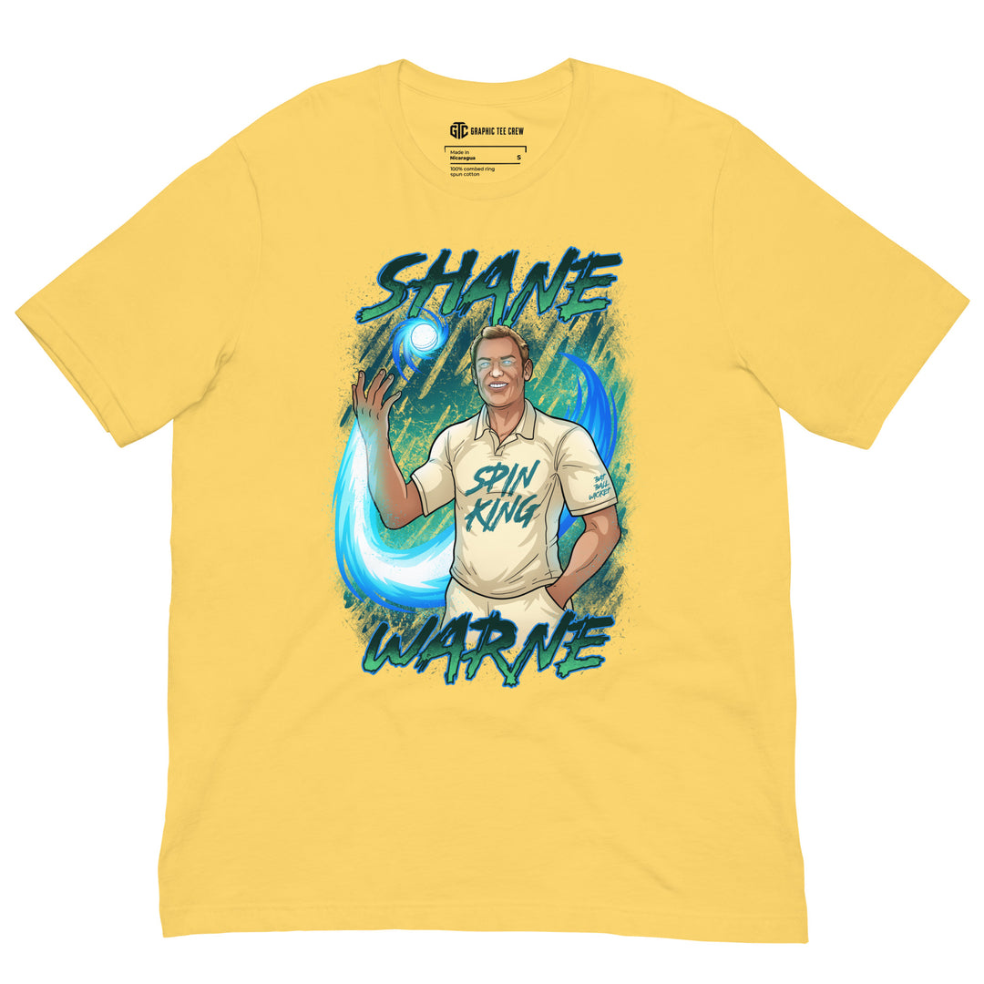 Shane Warne Spin King cricket T-shirt featuring the Australian leg-spin legend controlling a glowing cricket ball surrounded by swirling blue energy