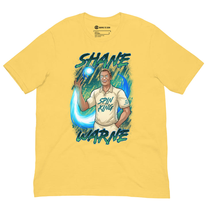 Shane Warne Spin King cricket T-shirt featuring the Australian leg-spin legend controlling a glowing cricket ball surrounded by swirling blue energy
