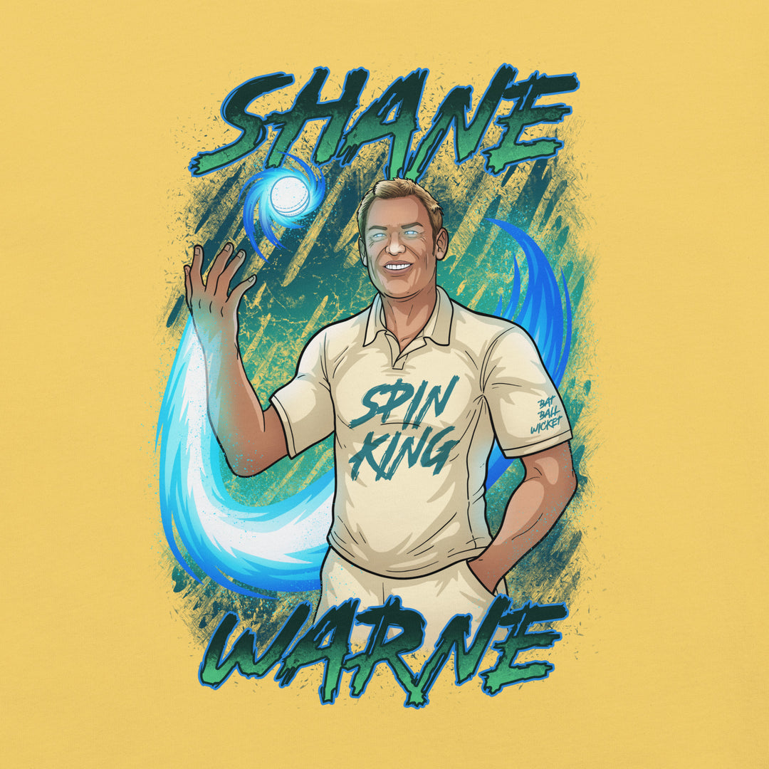 Shane Warne Spin King cricket T-shirt featuring the Australian leg-spin legend controlling a glowing cricket ball surrounded by swirling blue energy